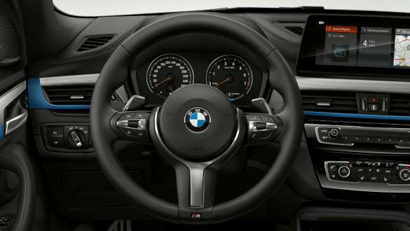 BMW X1, fjölnotastýri. BMW X1, innanrými með M Sport-pakka og M Sports-stýringu.