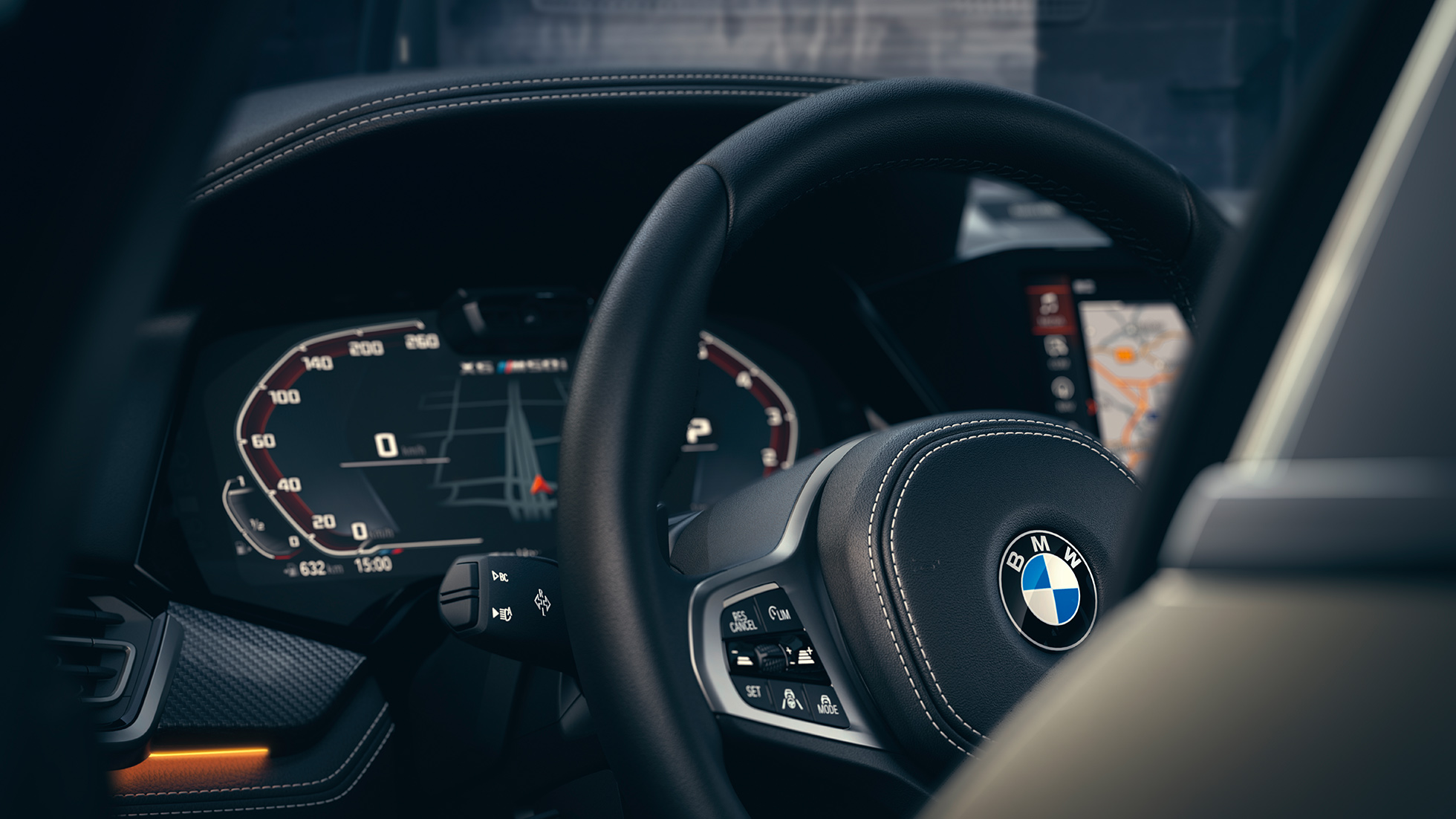 BMW-aðstoðarkerfi. Nærmynd af innanrými BMW með áherslu á mælaborð.