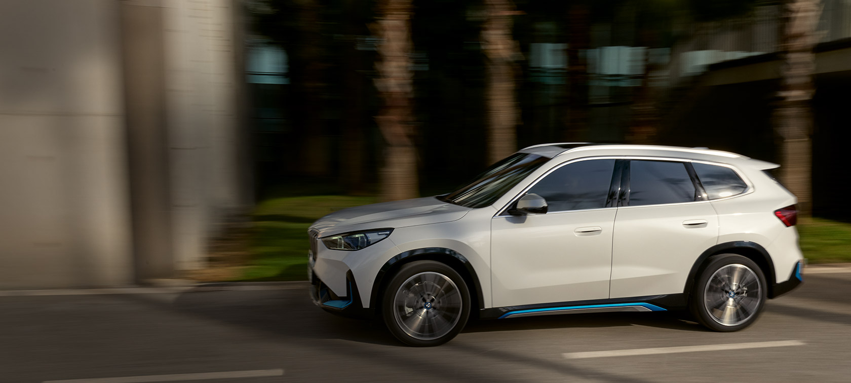 The BMW X5 travelling through the city at night